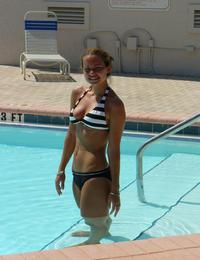 A tanned girl going topless on the Nugal Image 8