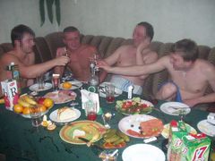 Four friends banging a brunette whore in black stockings. Image 1