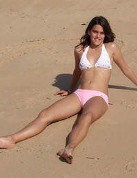 A slim girl posing on the Cap d'Agde Image 6