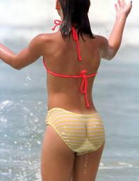 A slim girl posing on the Cap d'Agde Image 12